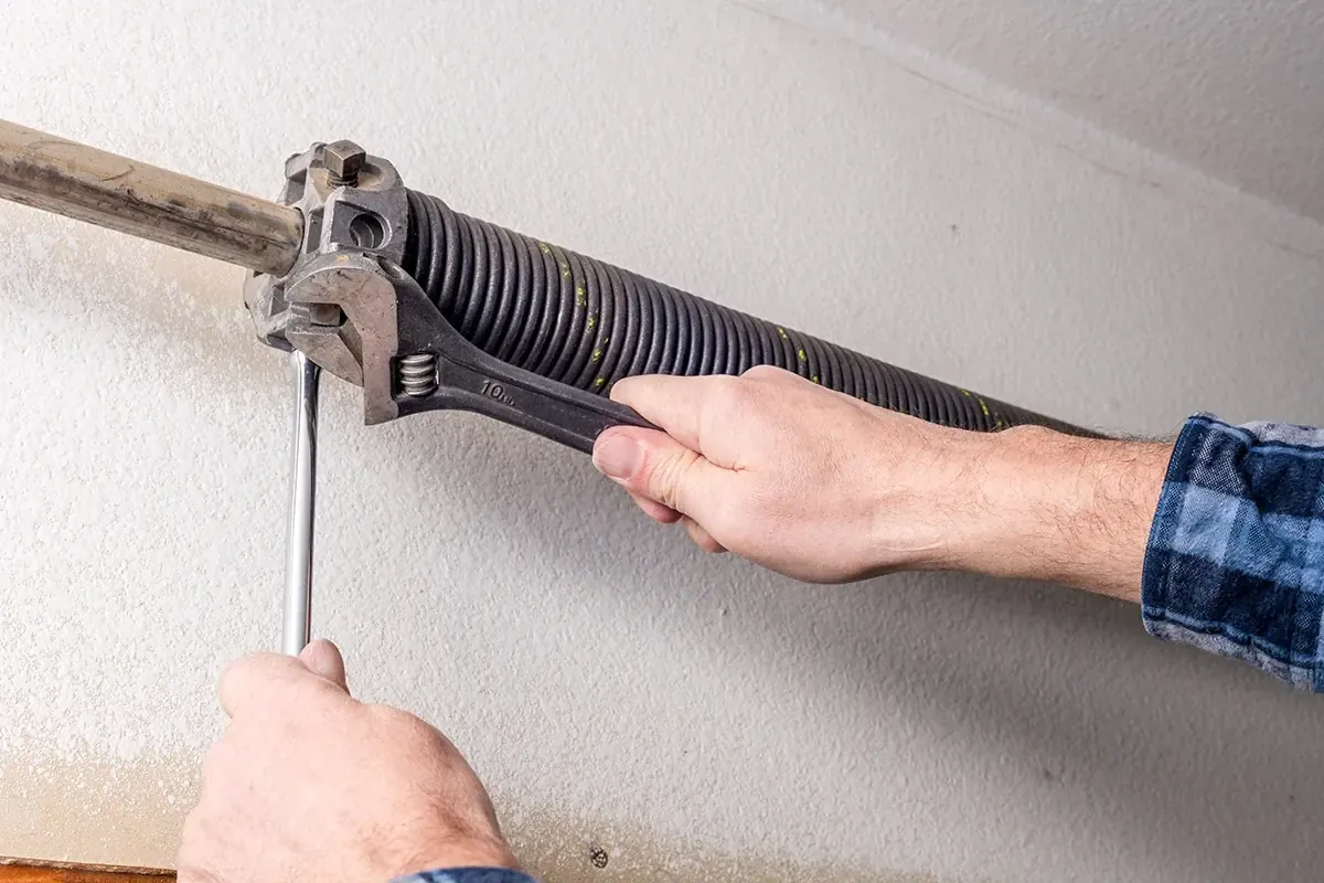 High-cycle oil-tempered torsion spring replacement and precision balance calibration on residential garage door