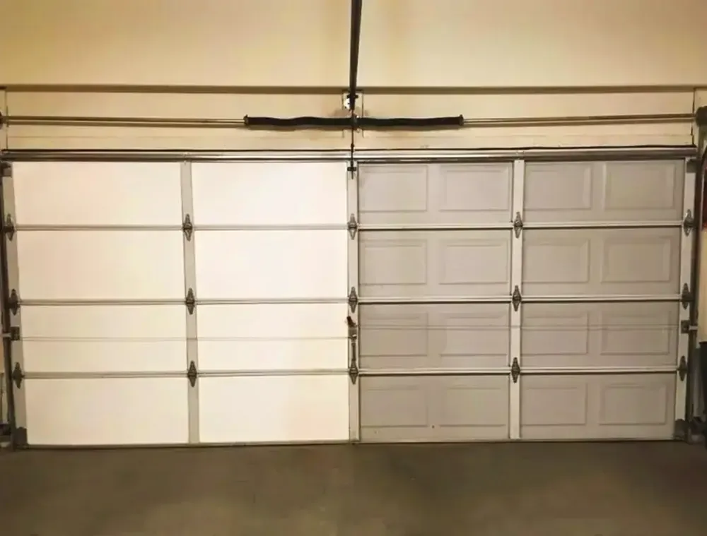 Custom polyurethane insulated residential garage door installation providing energy efficiency for Colorado winters